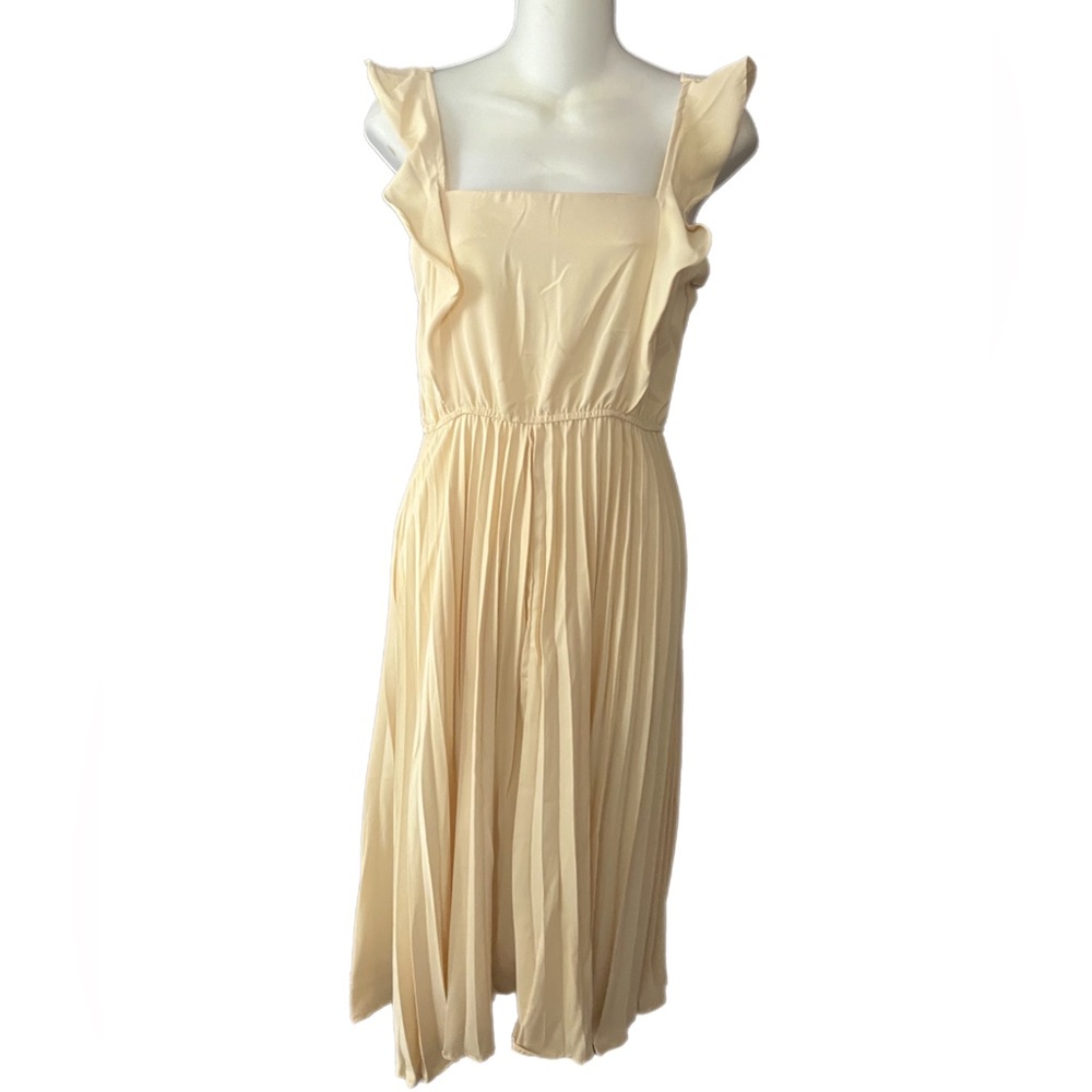 Handmade dress pleated knee length with elastic waste.  Etsy purchase.